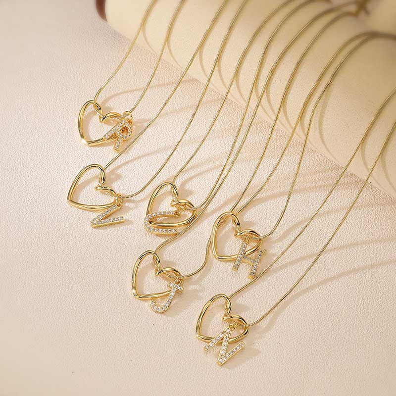 Elegant and versatile copper pendant necklace with zircon-inlaid heart and letter design