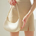 Lady crescent bag slung across one shoulder