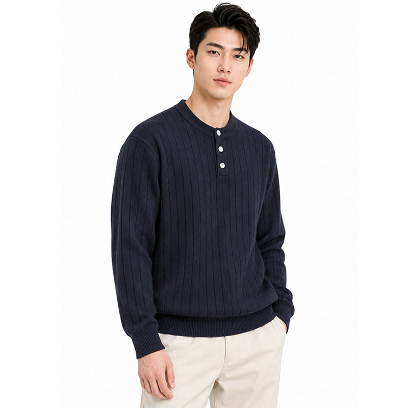 Mens Henry wears a vertical stripe knitted sweater.